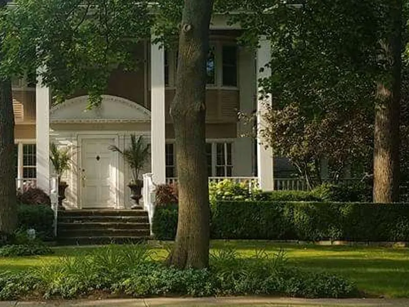 Mixed shrub and perennial plantings along a North Shore home